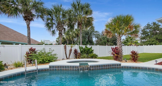 view of pool featuring a fenced backyard, a fenced in pool, and an in ground hot tub