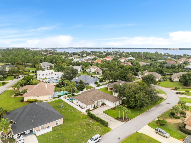 bird's eye view featuring a residential view and a water view