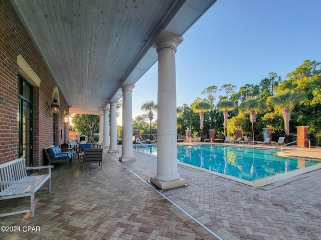 view of swimming pool with a patio and an outdoor hangout area