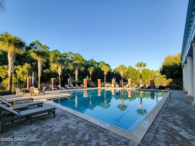 view of swimming pool with a patio