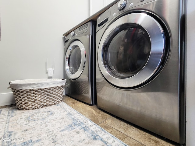 washroom featuring washer and clothes dryer