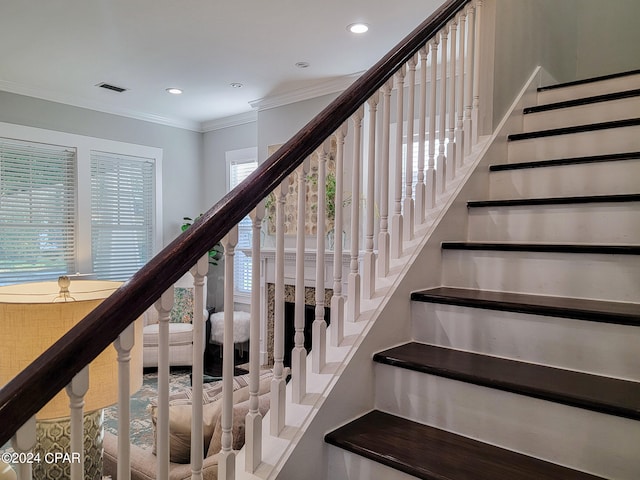 stairs with crown molding