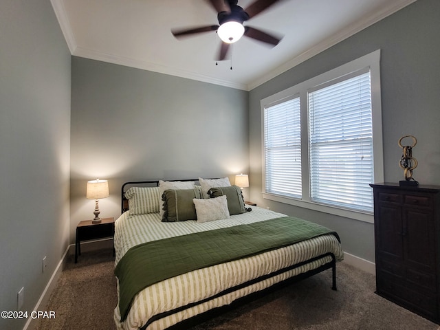 carpeted bedroom featuring ceiling fan and crown molding