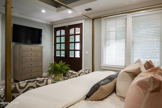 bedroom with french doors, multiple windows, and crown molding