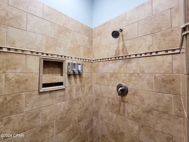 bathroom with a tile shower