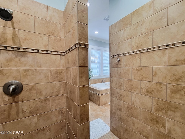 bathroom with tile patterned flooring and tiled shower