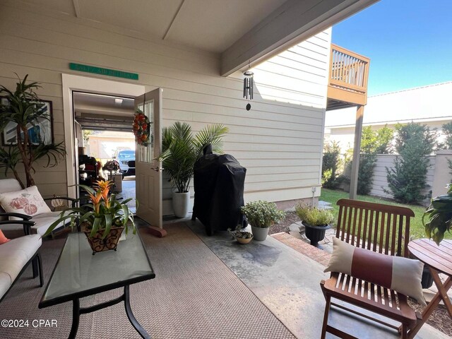 view of patio / terrace featuring a balcony and a grill