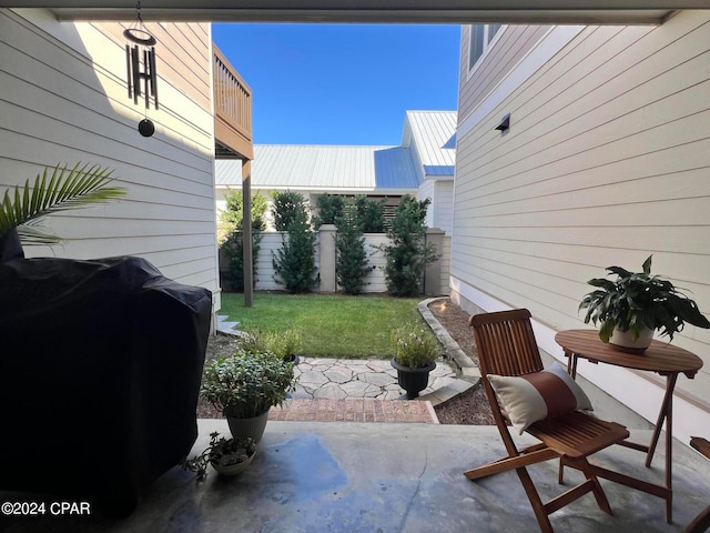 view of patio featuring a grill