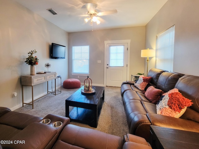 living room featuring light colored carpet and ceiling fan