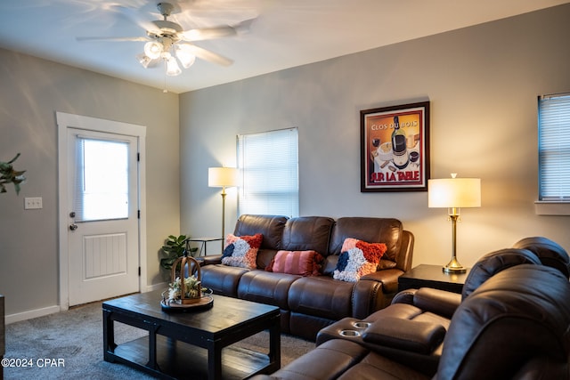 carpeted living room featuring ceiling fan