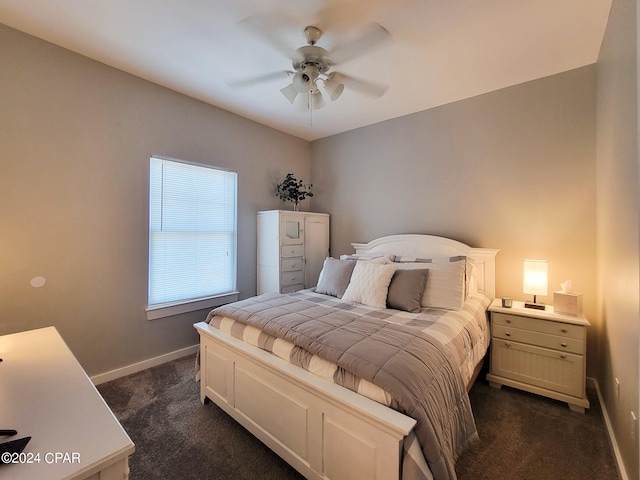 bedroom with dark carpet and ceiling fan