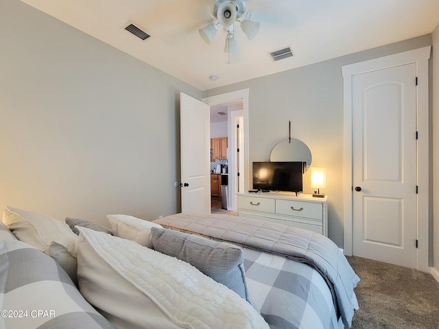 bedroom featuring ceiling fan and carpet