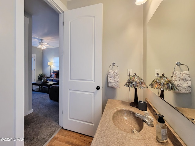 bathroom with vanity, wood-type flooring, and ceiling fan