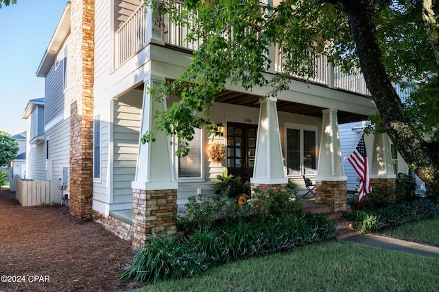 view of front of home with a balcony