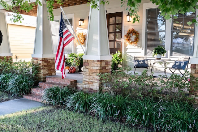 property entrance featuring covered porch