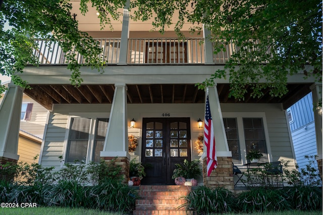 doorway to property featuring covered porch