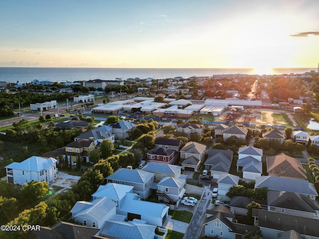 aerial view at dusk with a water view