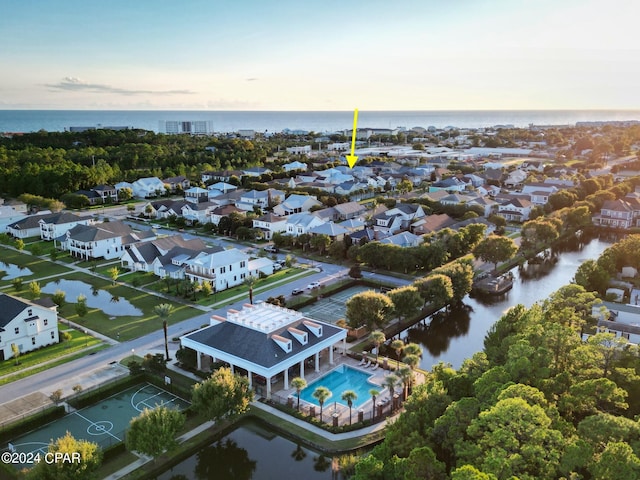 aerial view at dusk with a water view