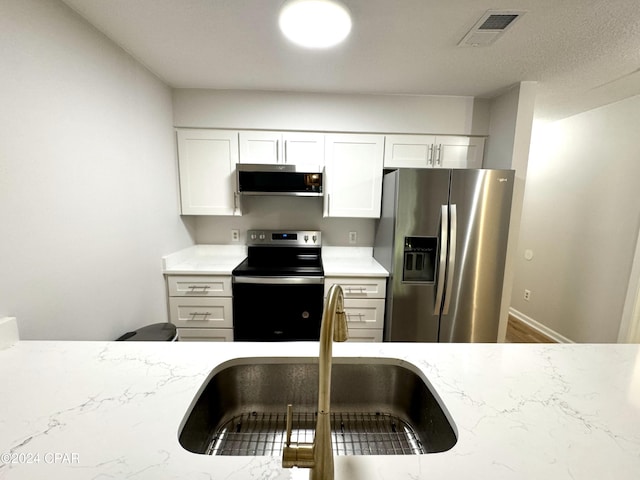 kitchen featuring sink, white cabinets, and stainless steel appliances