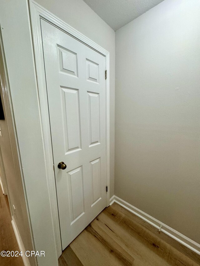 details featuring hardwood / wood-style floors and a textured ceiling