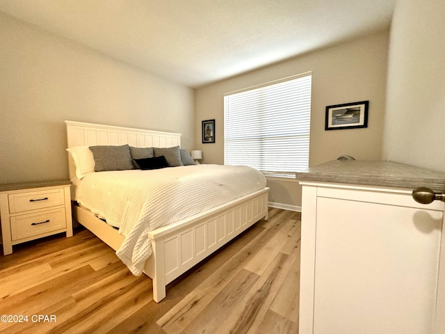 bedroom featuring light wood-type flooring