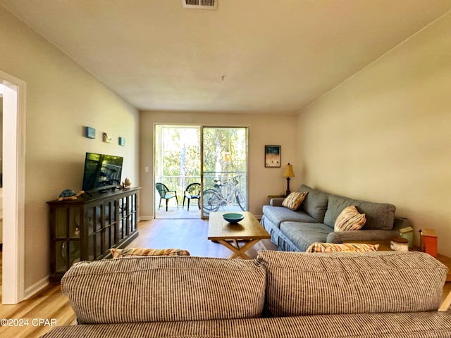 living room with light hardwood / wood-style flooring