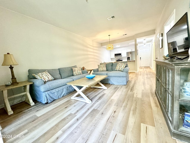 living room featuring light wood-type flooring