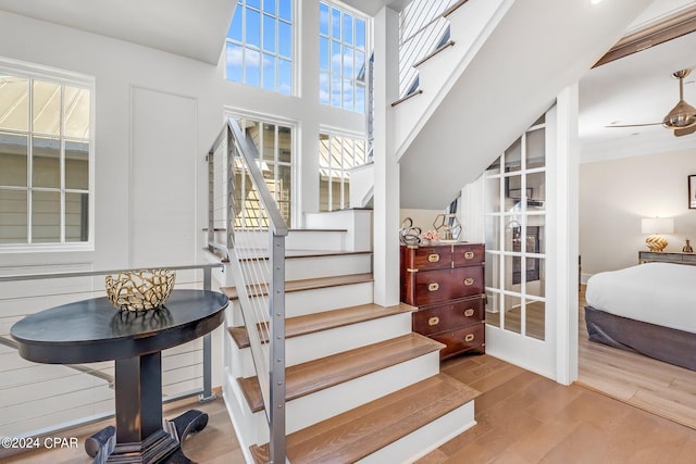 staircase with hardwood / wood-style flooring