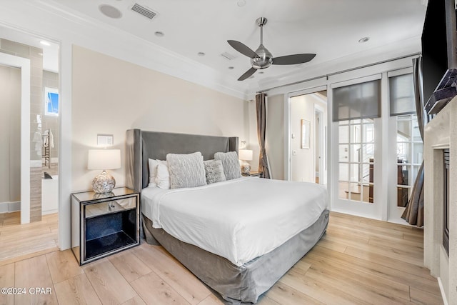 bedroom with light hardwood / wood-style flooring, ceiling fan, and ornamental molding