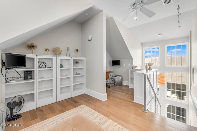 office area featuring light wood-type flooring, ceiling fan, and lofted ceiling