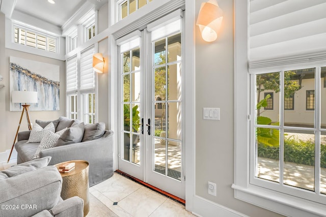 doorway to outside with french doors and light tile patterned floors