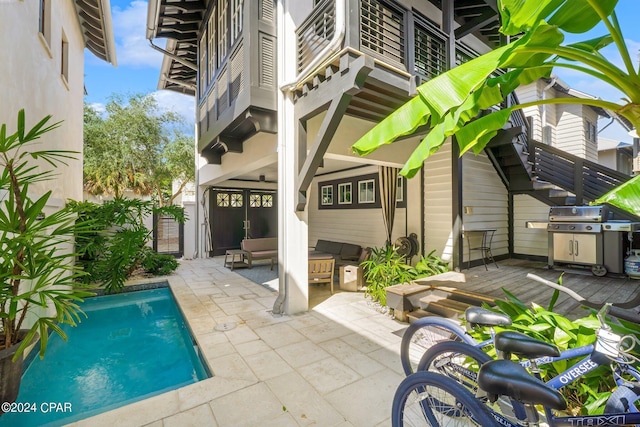 198 E Water St, Inlet Beach, FL 32461 - rear view of property featuring stairs, an outdoor pool, a patio area, and an outdoor living space