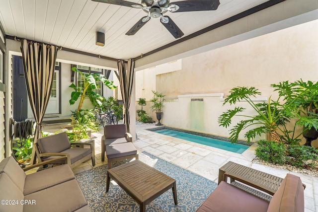 view of pool with a patio area, ceiling fan, and outdoor lounge area