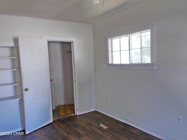 7949 Old Spanish Trl, Sneads, FL 32460 - unfurnished bedroom featuring wood finished floors