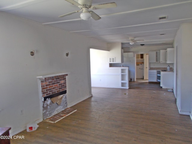 7949 Old Spanish Trl, Sneads, FL 32460 - unfurnished living room featuring visible vents, a brick fireplace, baseboards, wood finished floors, and a ceiling fan
