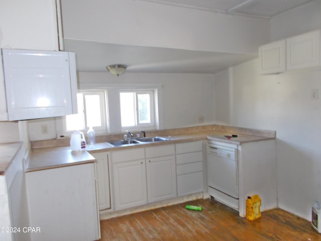 7949 Old Spanish Trl, Sneads, FL 32460 - kitchen featuring light countertops, wood finished floors, white cabinetry, white dishwasher, and a sink