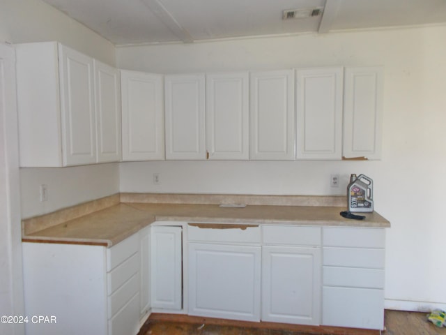 7949 Old Spanish Trl, Sneads, FL 32460 - kitchen with visible vents, white cabinetry, and light countertops