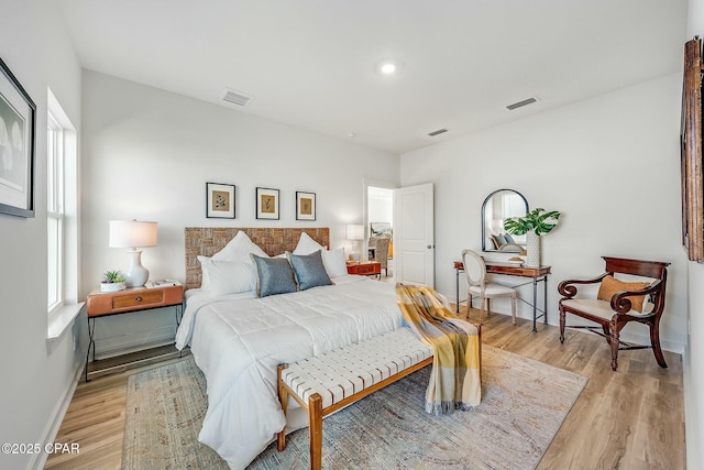 bedroom with light hardwood / wood-style flooring