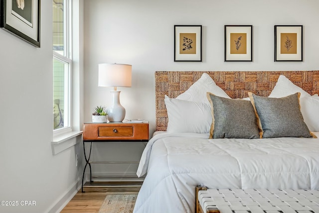 bedroom with light hardwood / wood-style flooring