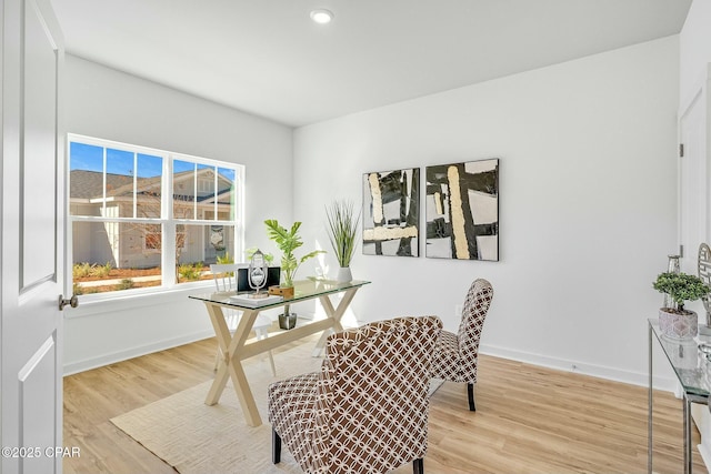 office space with light hardwood / wood-style flooring