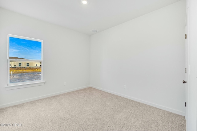 empty room with carpet flooring