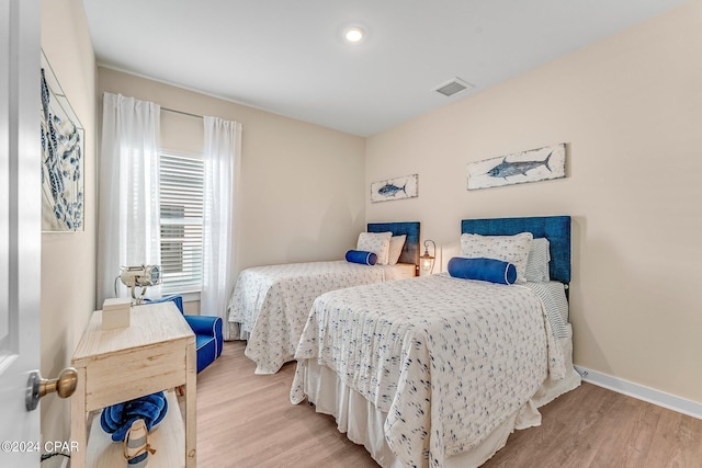 bedroom featuring light hardwood / wood-style floors