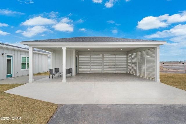 garage featuring a carport