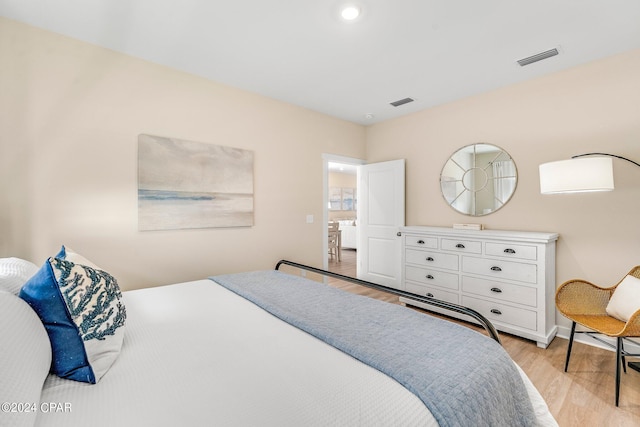 bedroom with light hardwood / wood-style flooring