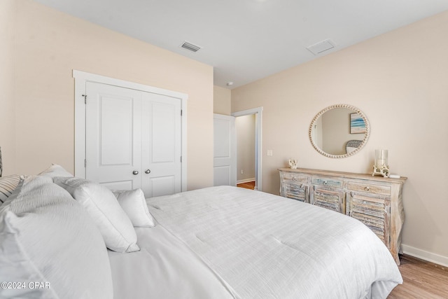 bedroom with a closet and light wood-type flooring