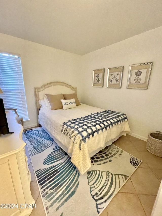 tiled bedroom with baseboards