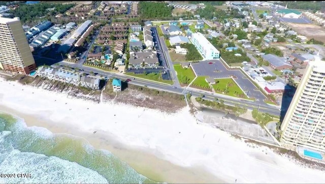 bird's eye view with a water view and a view of the beach