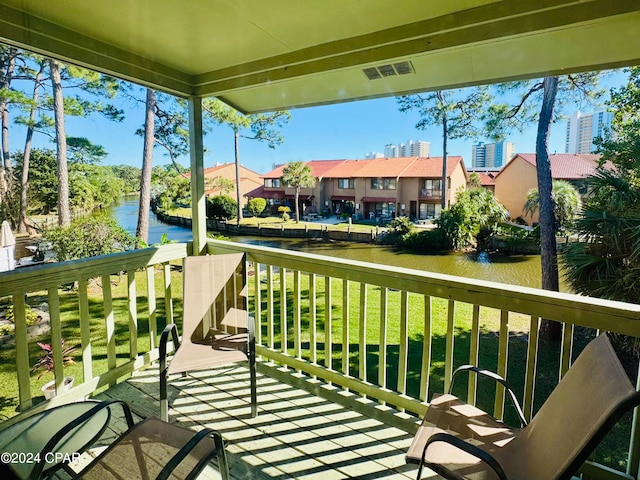 balcony featuring a water view