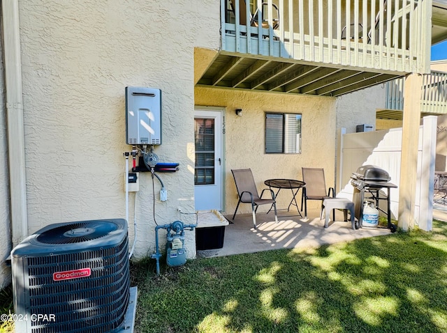 exterior space with area for grilling and central AC unit