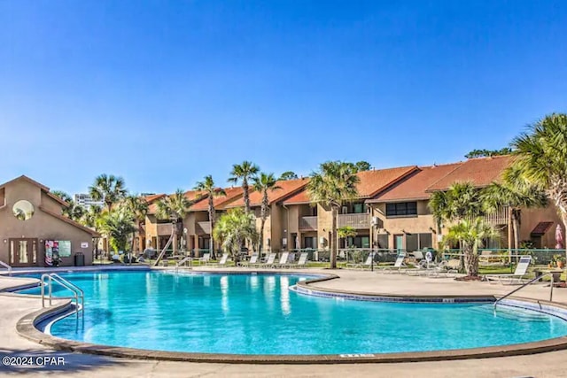 view of swimming pool with a patio area